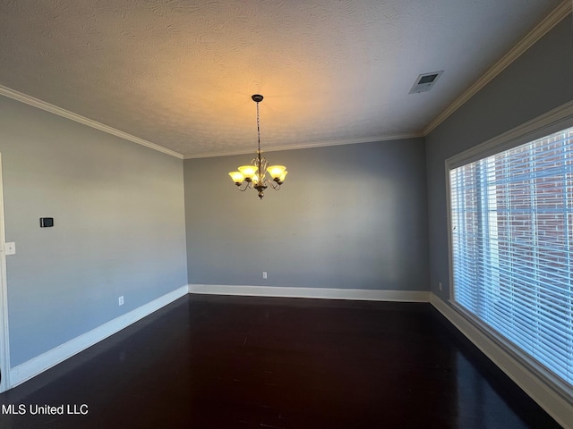 spare room featuring dark wood-style floors, visible vents, a textured ceiling, a chandelier, and baseboards