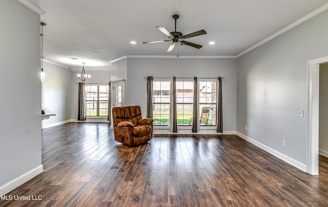 unfurnished room featuring dark wood-type flooring, ornamental molding, ceiling fan with notable chandelier, recessed lighting, and baseboards