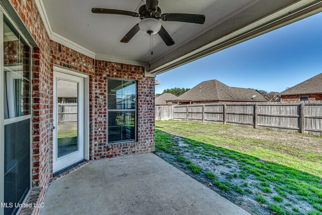 view of patio / terrace with a fenced backyard and ceiling fan