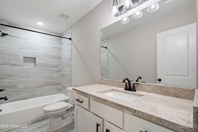 full bathroom with vanity, tiled shower / bath combo, hardwood / wood-style flooring, and toilet