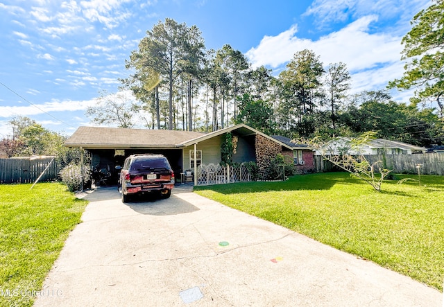 view of front of house with a front yard and a carport