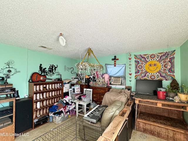 interior space featuring cooling unit and a textured ceiling