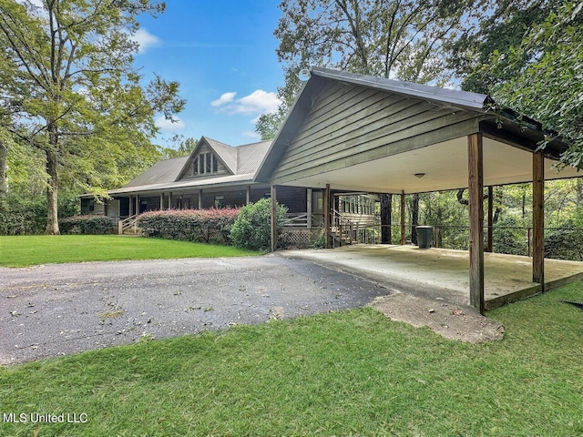 159 Vard Sullivan Rd, Pinola, MS 39149 - view of community featuring a carport, a yard, and driveway