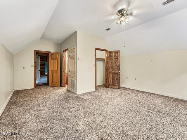 159 Vard Sullivan Rd, Pinola, MS 39149 - unfurnished bedroom featuring carpet floors, baseboards, vaulted ceiling, and visible vents