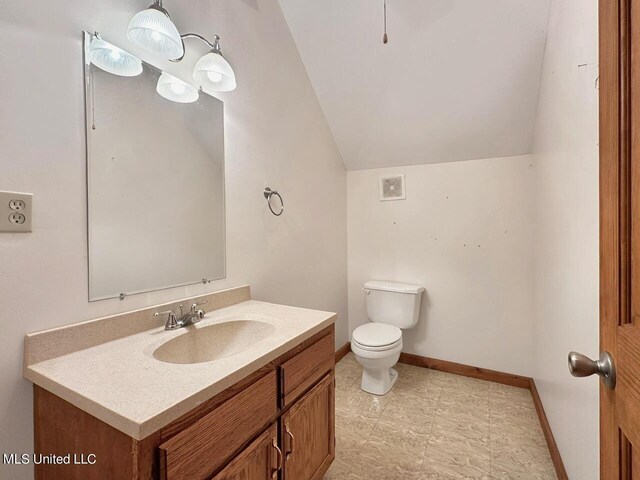 159 Vard Sullivan Rd, Pinola, MS 39149 - bathroom with visible vents, baseboards, vanity, toilet, and lofted ceiling