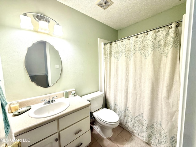 2006 Eden St, Pascagoula, MS 39581 - full bathroom with a textured ceiling, tile patterned floors, vanity, toilet, and a shower with curtain