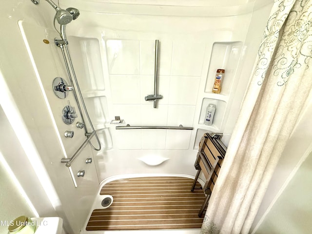 2006 Eden St, Pascagoula, MS 39581 - full bathroom with a shower with curtain and wood finished floors