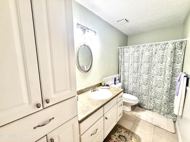 2006 Eden St, Pascagoula, MS 39581 - full bath featuring a textured ceiling, tile patterned flooring, toilet, vanity, and a shower with shower curtain