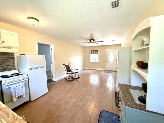 2006 Eden St, Pascagoula, MS 39581 - kitchen featuring white appliances, premium range hood, ceiling fan, a textured ceiling, and light wood finished floors