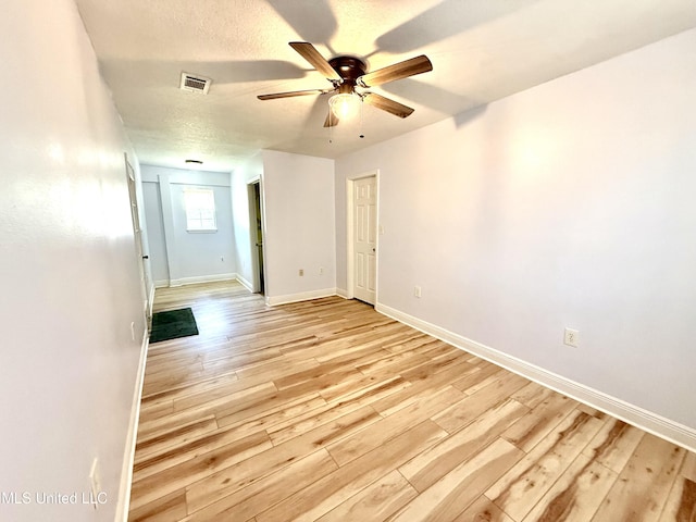2006 Eden St, Pascagoula, MS 39581 - spare room with ceiling fan, light wood-style flooring, and baseboards