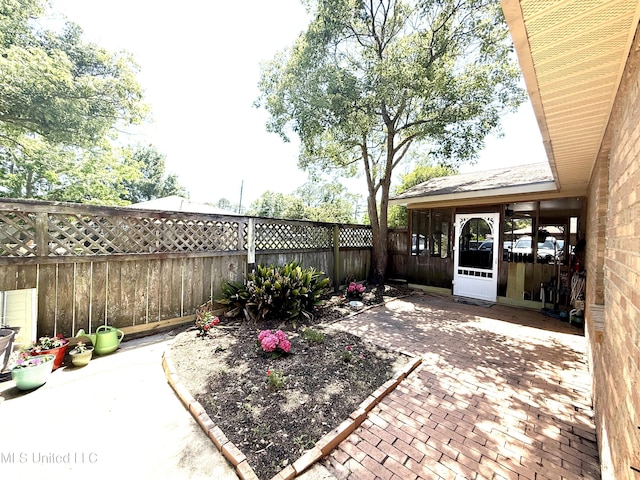 2006 Eden St, Pascagoula, MS 39581 - view of patio / terrace featuring a fenced backyard and a sunroom