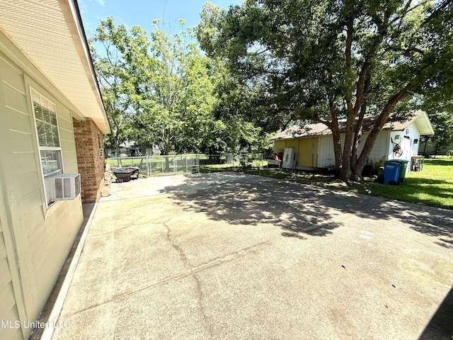 2006 Eden St, Pascagoula, MS 39581 - view of patio / terrace featuring fence, cooling unit, and driveway