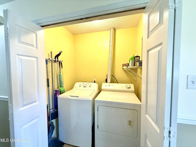 2006 Eden St, Pascagoula, MS 39581 - laundry room featuring independent washer and dryer and a textured ceiling