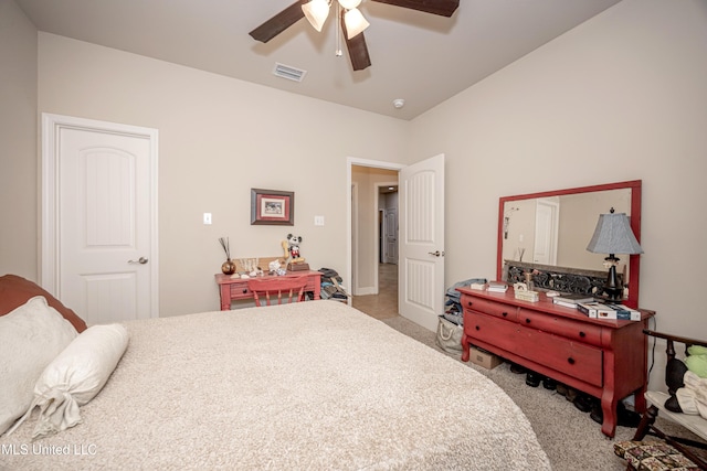 bedroom with a ceiling fan, visible vents, and carpet