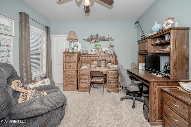 office with light colored carpet and a ceiling fan