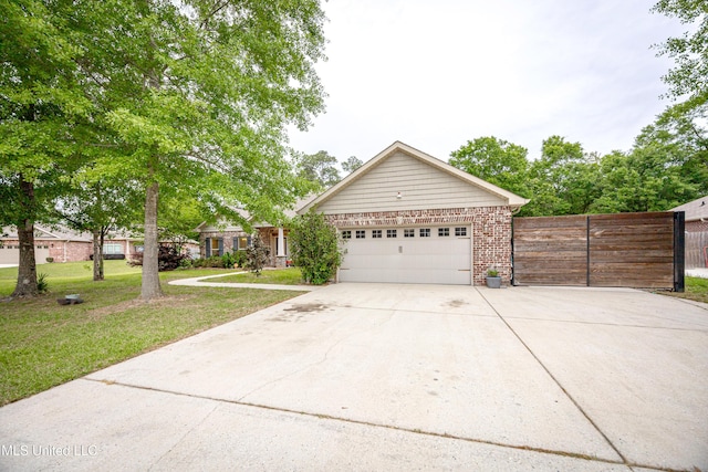ranch-style home featuring a garage, concrete driveway, fence, a front yard, and brick siding