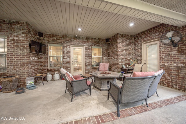 view of patio / terrace with an outdoor living space with a fire pit