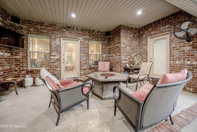 view of patio with a fire pit