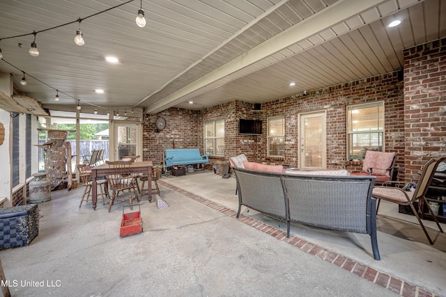 view of patio / terrace with fence, an outdoor hangout area, and outdoor dining space