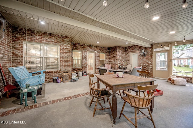 dining area with brick wall