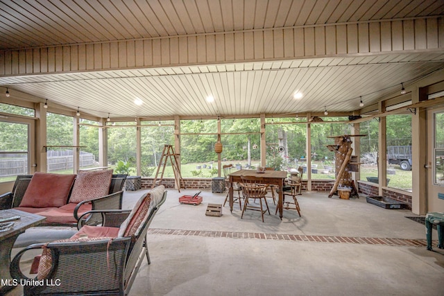 sunroom / solarium featuring an outdoor hangout area and outdoor dining space