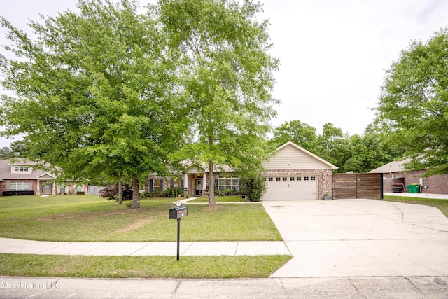 view of property hidden behind natural elements featuring an attached garage, a front lawn, driveway, and fence