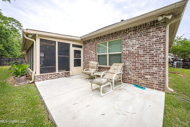 view of patio featuring a sunroom, fence, and cooling unit