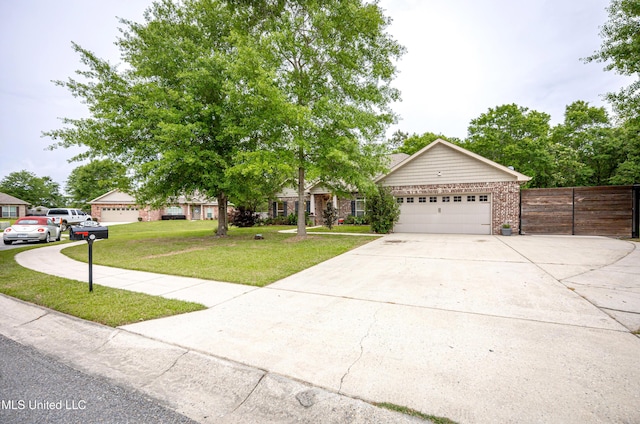 view of front facade featuring concrete driveway, an attached garage, fence, a front yard, and brick siding