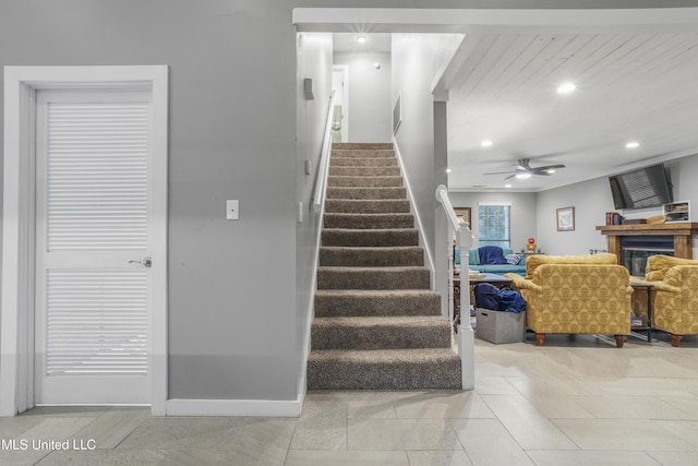 stairs with ceiling fan