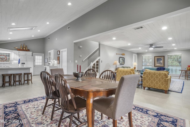 tiled dining space featuring ceiling fan, lofted ceiling, and wood ceiling