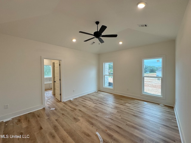 unfurnished room with ceiling fan and light wood-type flooring