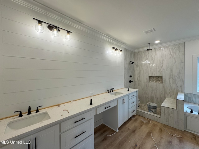 bathroom with vanity, wood-type flooring, ornamental molding, and independent shower and bath