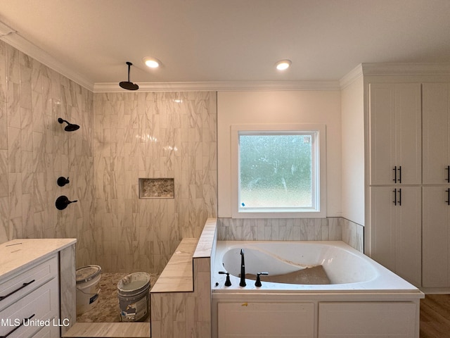 bathroom featuring independent shower and bath, ornamental molding, and vanity