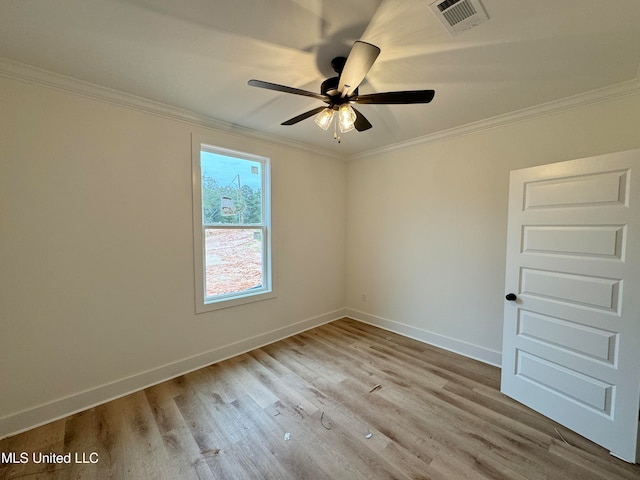 empty room with crown molding, light hardwood / wood-style floors, and ceiling fan