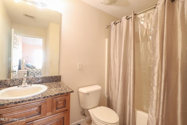 full bathroom with vanity, shower / bathtub combination with curtain, a textured ceiling, and toilet