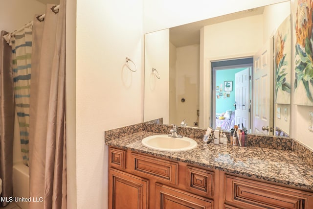 bathroom featuring vanity and shower / bath combo