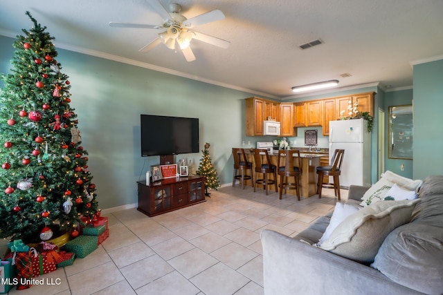 living room with crown molding, light tile patterned flooring, and ceiling fan