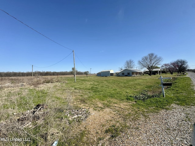126 Interstate Rd, Shaw, MS 38773 - view of yard featuring an outbuilding and a rural view