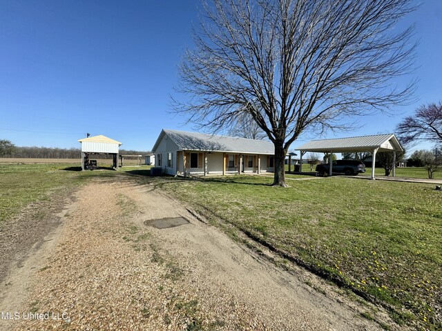 126 Interstate Rd, Shaw, MS 38773 - view of front of house with driveway, metal roof, and a front lawn