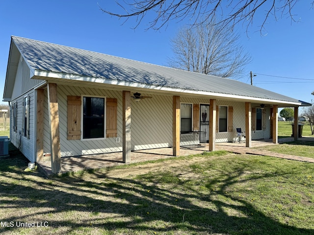 126 Interstate Rd, Shaw, MS 38773 - view of front of house with metal roof, a ceiling fan, cooling unit, and a front yard