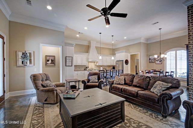 living area featuring crown molding, ceiling fan with notable chandelier, visible vents, and baseboards