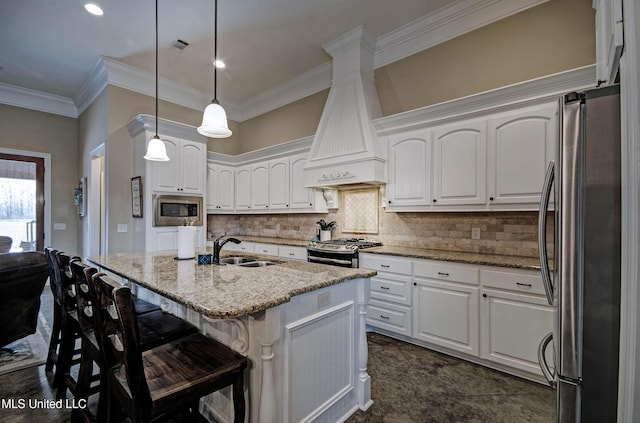 kitchen featuring a sink, white cabinetry, stainless steel appliances, decorative backsplash, and custom exhaust hood