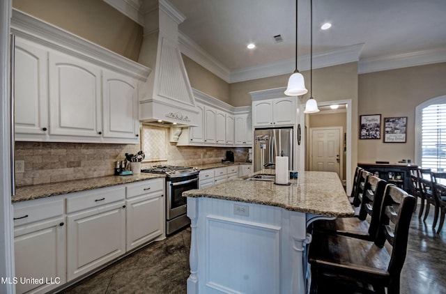 kitchen featuring appliances with stainless steel finishes, white cabinets, and custom range hood