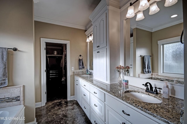 full bath featuring crown molding, double vanity, and a sink