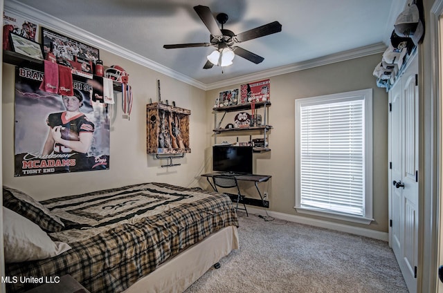 carpeted bedroom featuring crown molding, baseboards, and ceiling fan