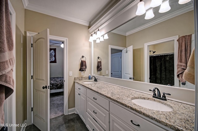 full bath featuring crown molding, double vanity, baseboards, and a sink