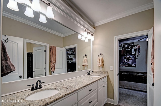 bathroom with a sink, double vanity, and crown molding