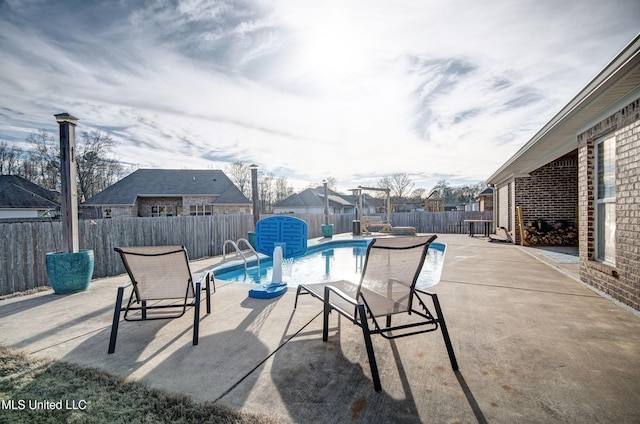 view of patio featuring a fenced in pool and a fenced backyard