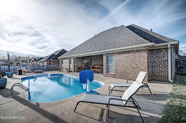 view of swimming pool featuring a patio area, a fenced in pool, and a fenced backyard