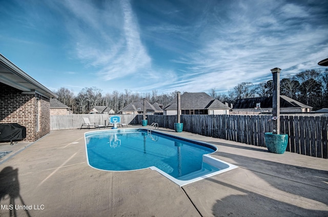 view of pool featuring a patio area, a fenced in pool, and a fenced backyard